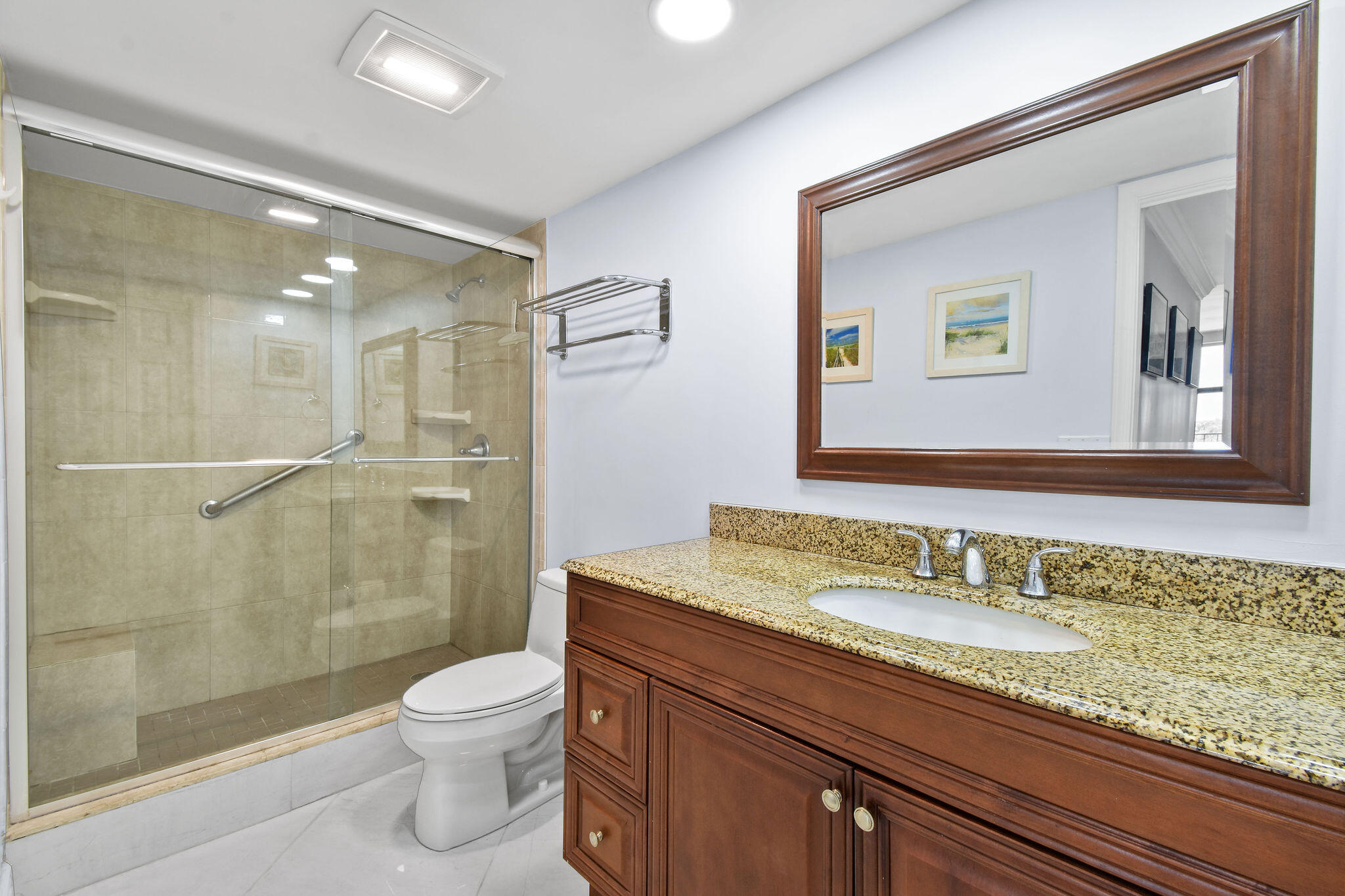 3460 South Ocean Boulevard, Unit 5100 Palm Beach, FL 33480 - Photo 12 of 42 a bathroom with a granite countertop sink a toilet and shower