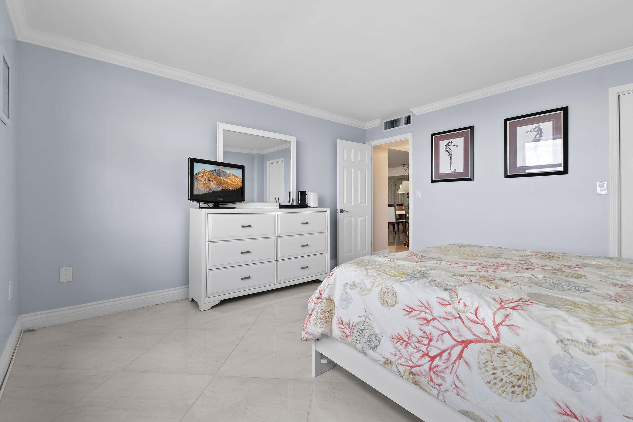 3460 South Ocean Boulevard, Unit 5100 Palm Beach, FL 33480 - Photo 17 of 42 a bedroom with a bed and a dresser