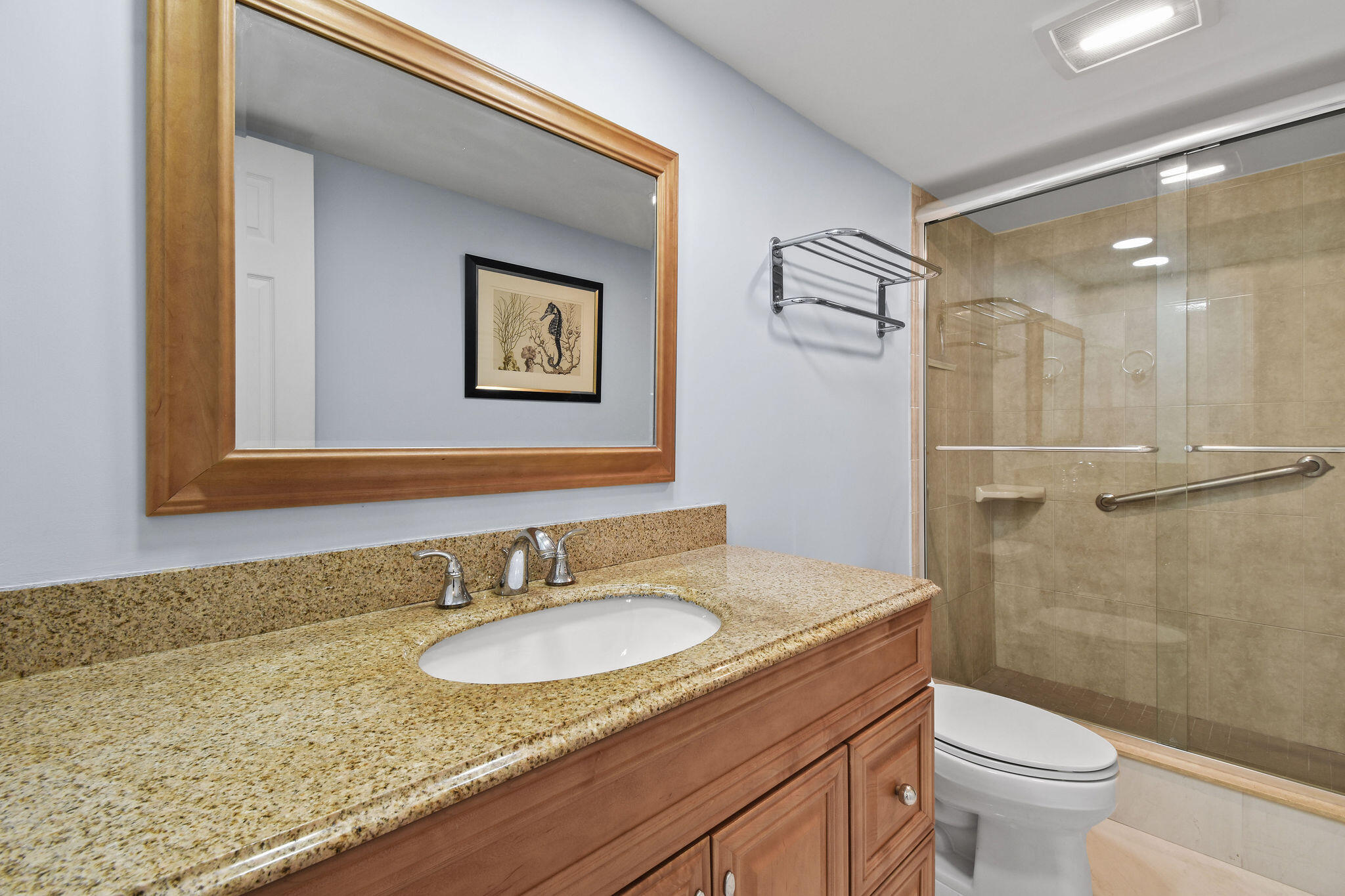 3460 South Ocean Boulevard, Unit 5100 Palm Beach, FL 33480 - Photo 18 of 42 a bathroom with a granite countertop sink toilet and a shower
