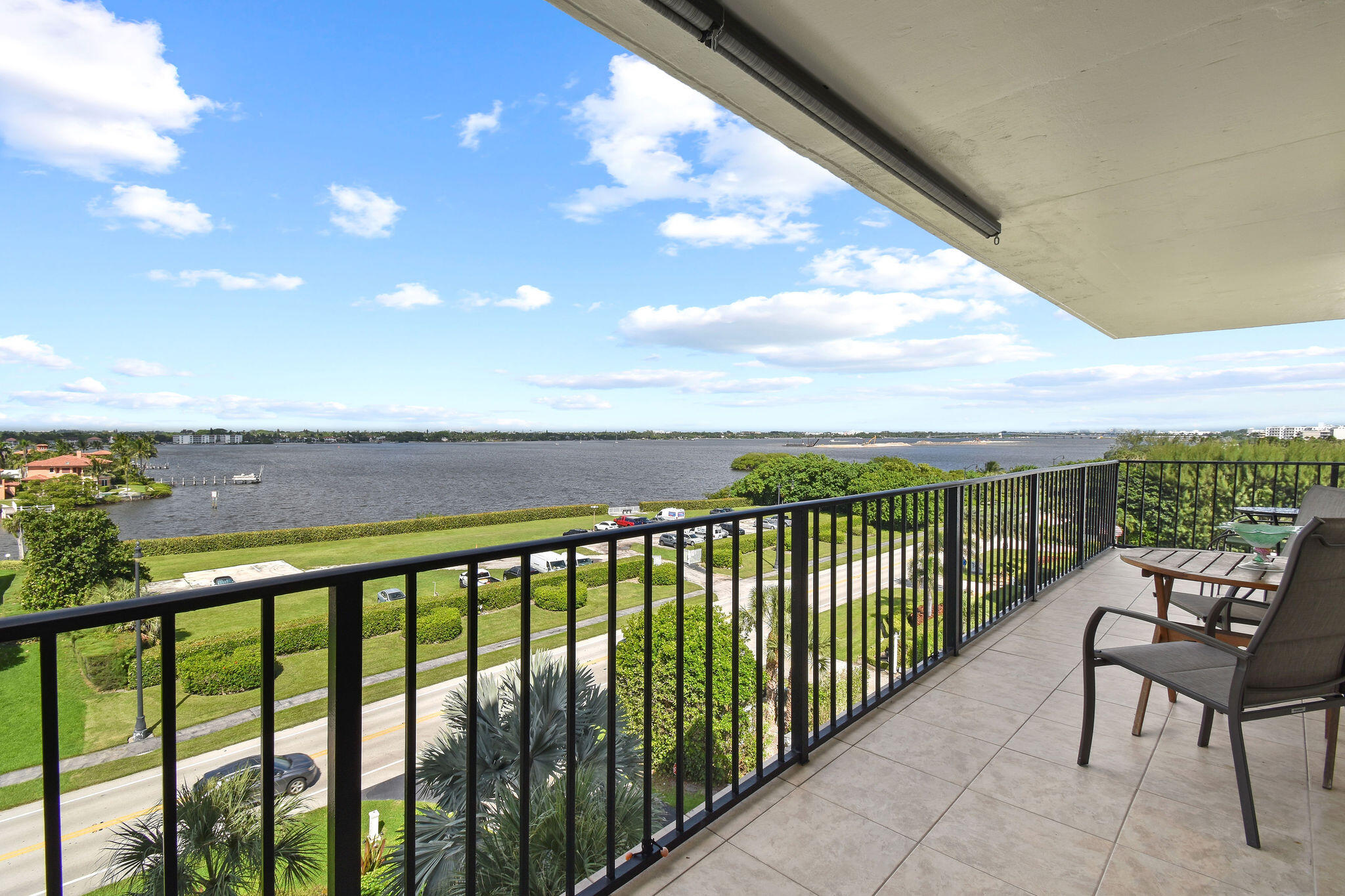 3460 South Ocean Boulevard, Unit 5100 Palm Beach, FL 33480 - Photo 20 of 42 a view of a balcony with chairs