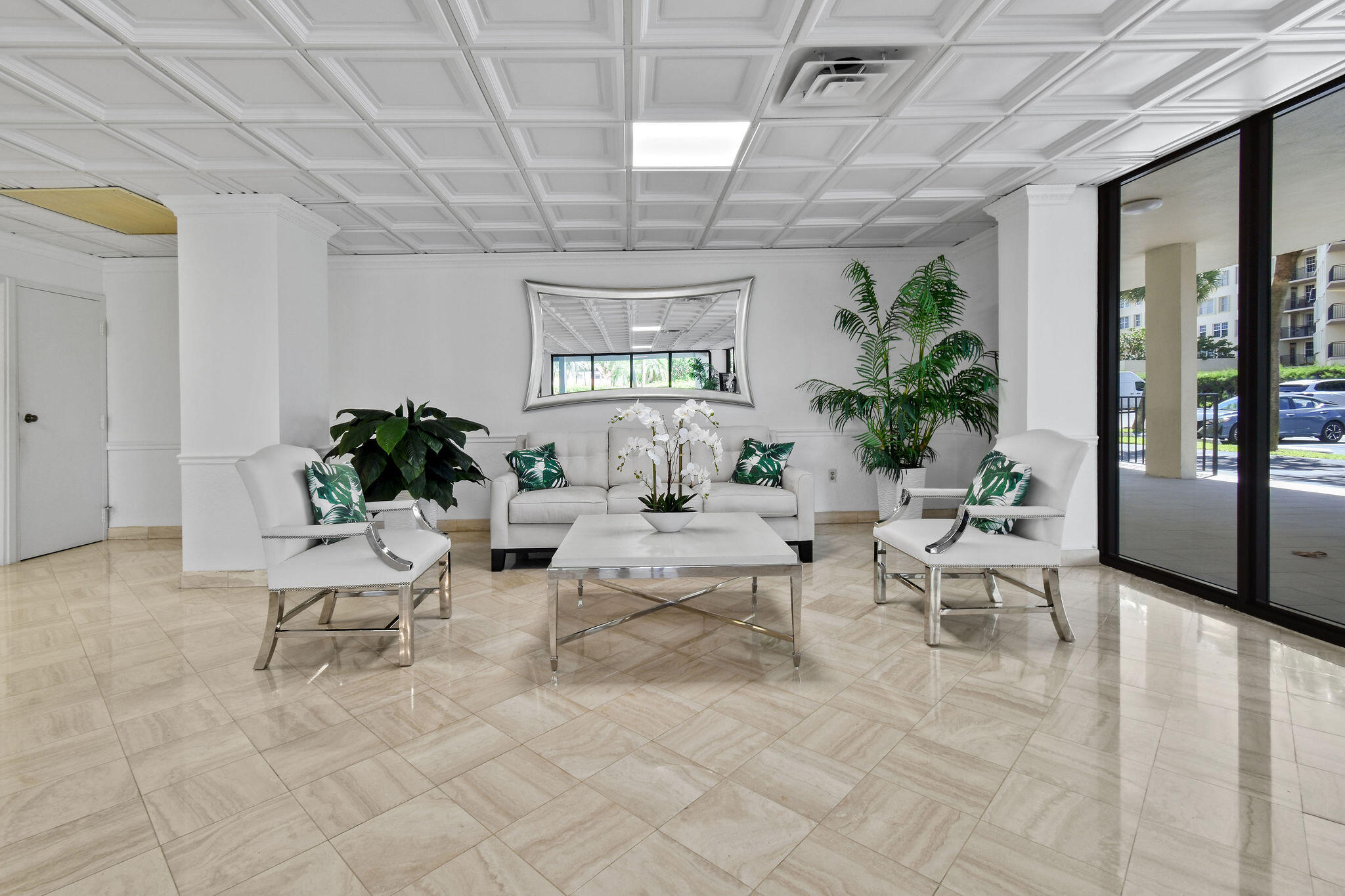 3460 South Ocean Boulevard, Unit 5100 Palm Beach, FL 33480 - Photo 24 of 42 a living room with furniture and a potted plant
