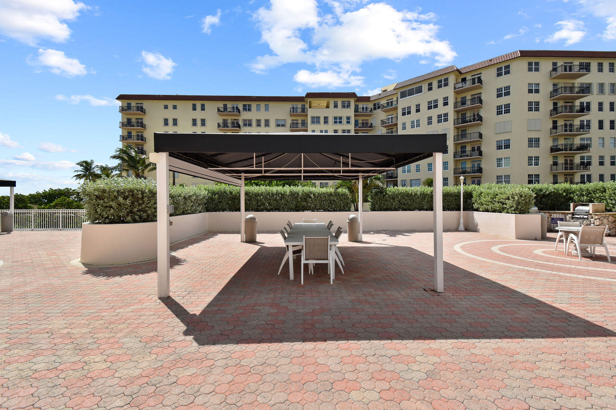 3460 South Ocean Boulevard, Unit 5100 Palm Beach, FL 33480 - Photo 29 of 42 a view of a patio with couches and wooden floor
