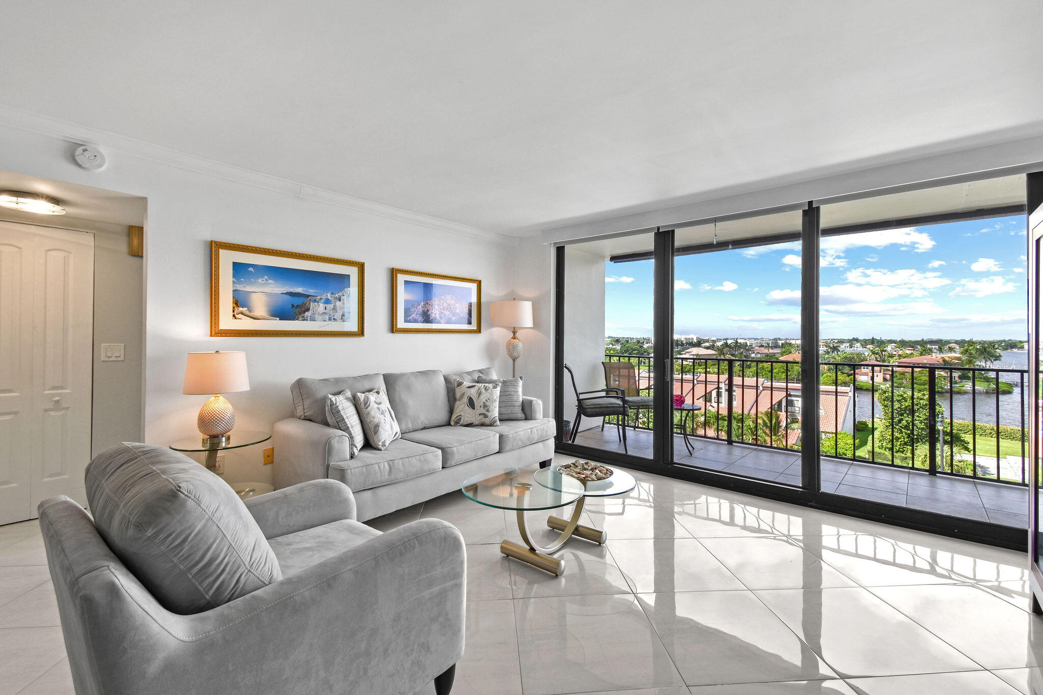 3460 South Ocean Boulevard, Unit 5100 Palm Beach, FL 33480 - Photo 3 of 42 a living room with furniture and a large window with outer view