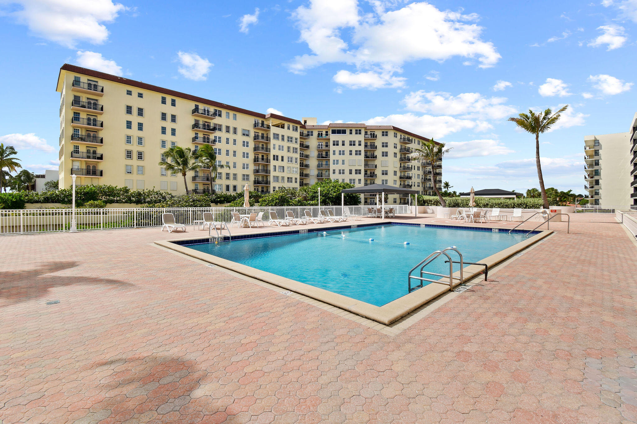 3460 South Ocean Boulevard, Unit 5100 Palm Beach, FL 33480 - Photo 33 of 42 a view of swimming pool with outdoor seating and a ocean view
