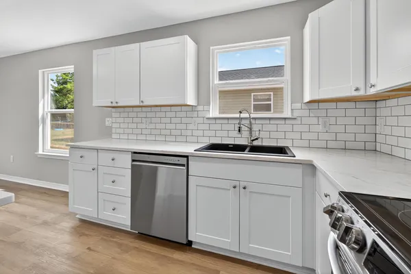 a kitchen with a sink and cabinets