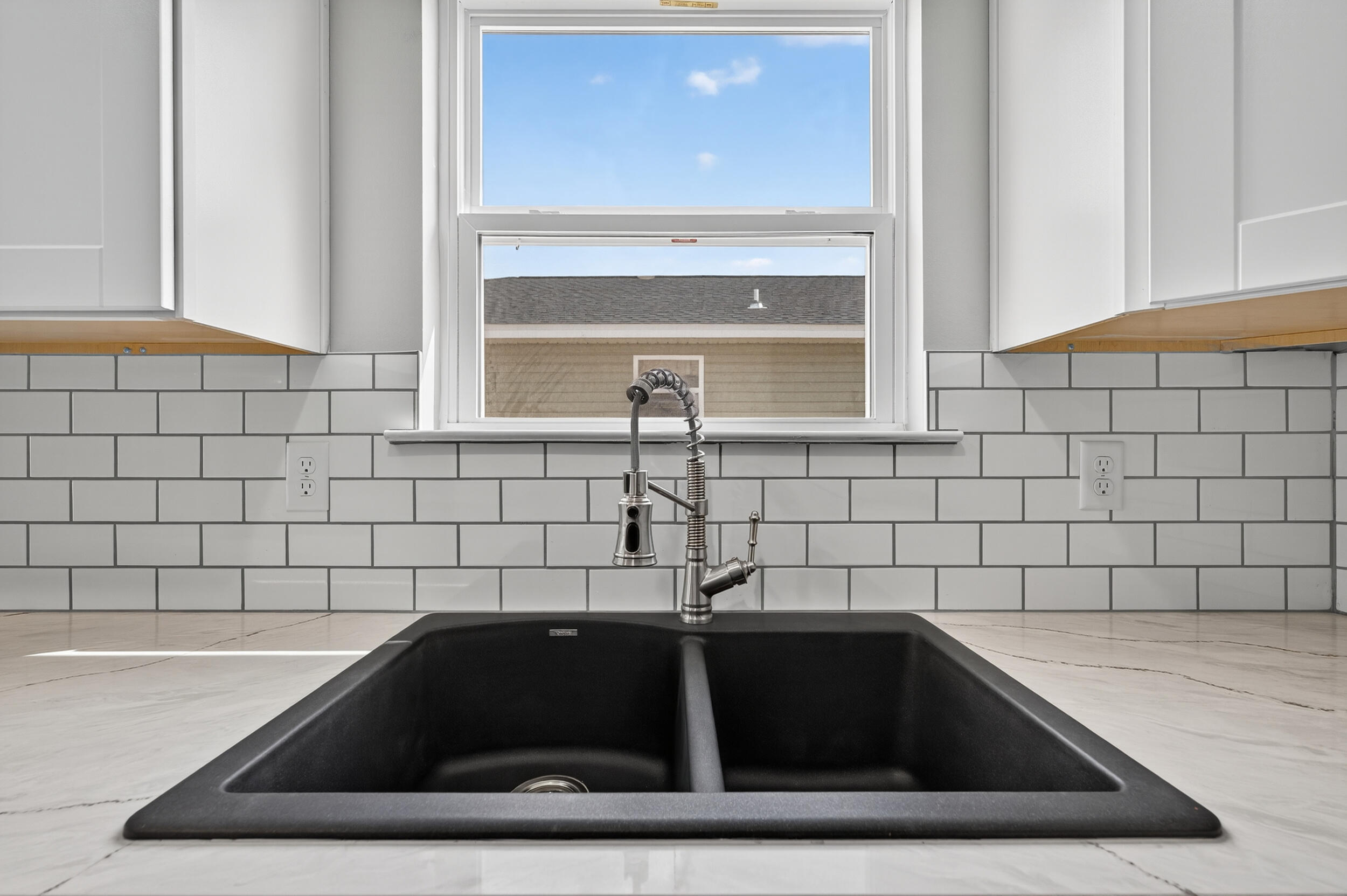 5327 B Kervin Road Crestview, FL 32539 - Photo 12 of 47 a kitchen with a sink and cabinets