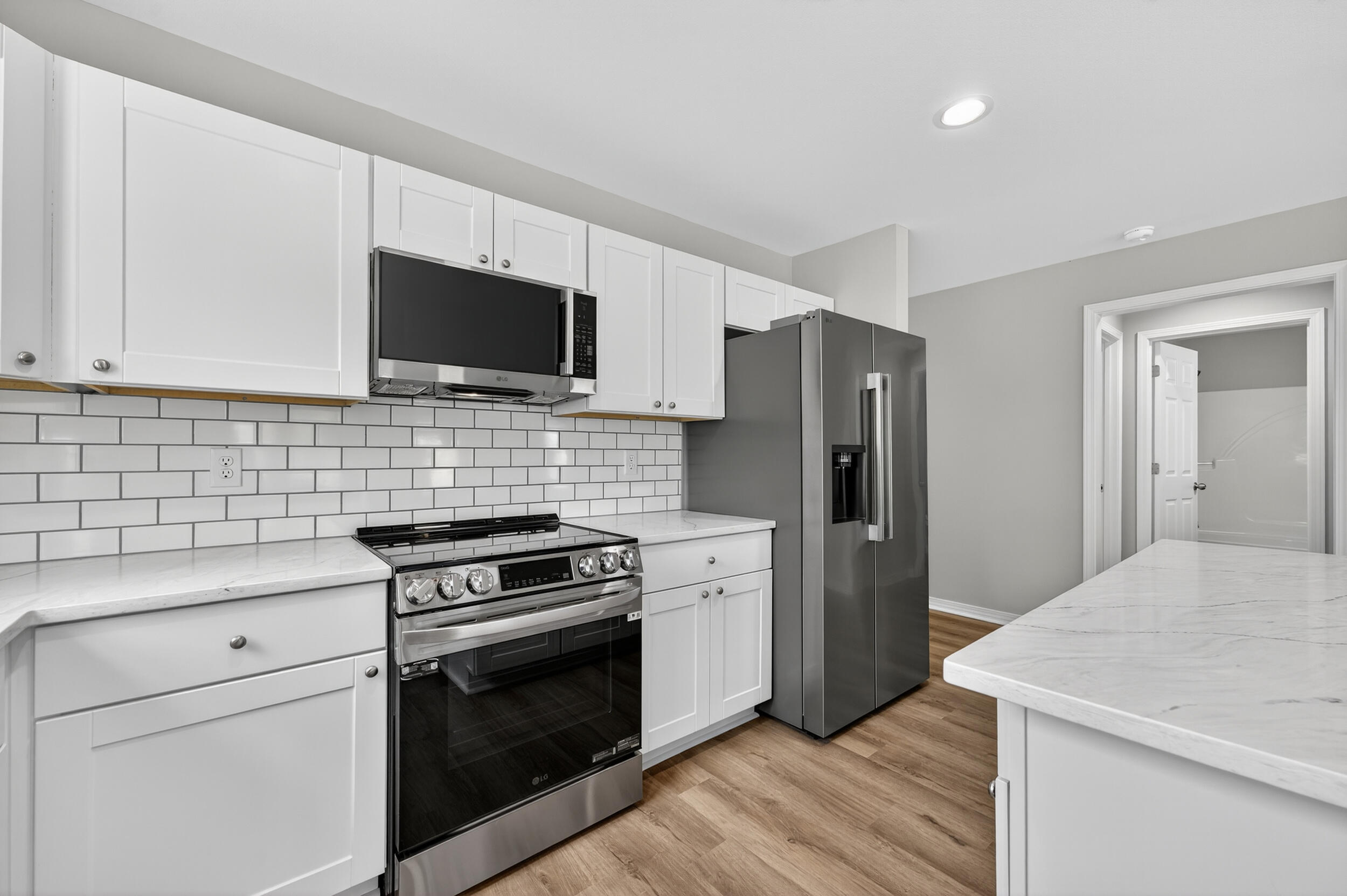 5327 B Kervin Road Crestview, FL 32539 - Photo 13 of 47 a kitchen with a stove a refrigerator and a sink