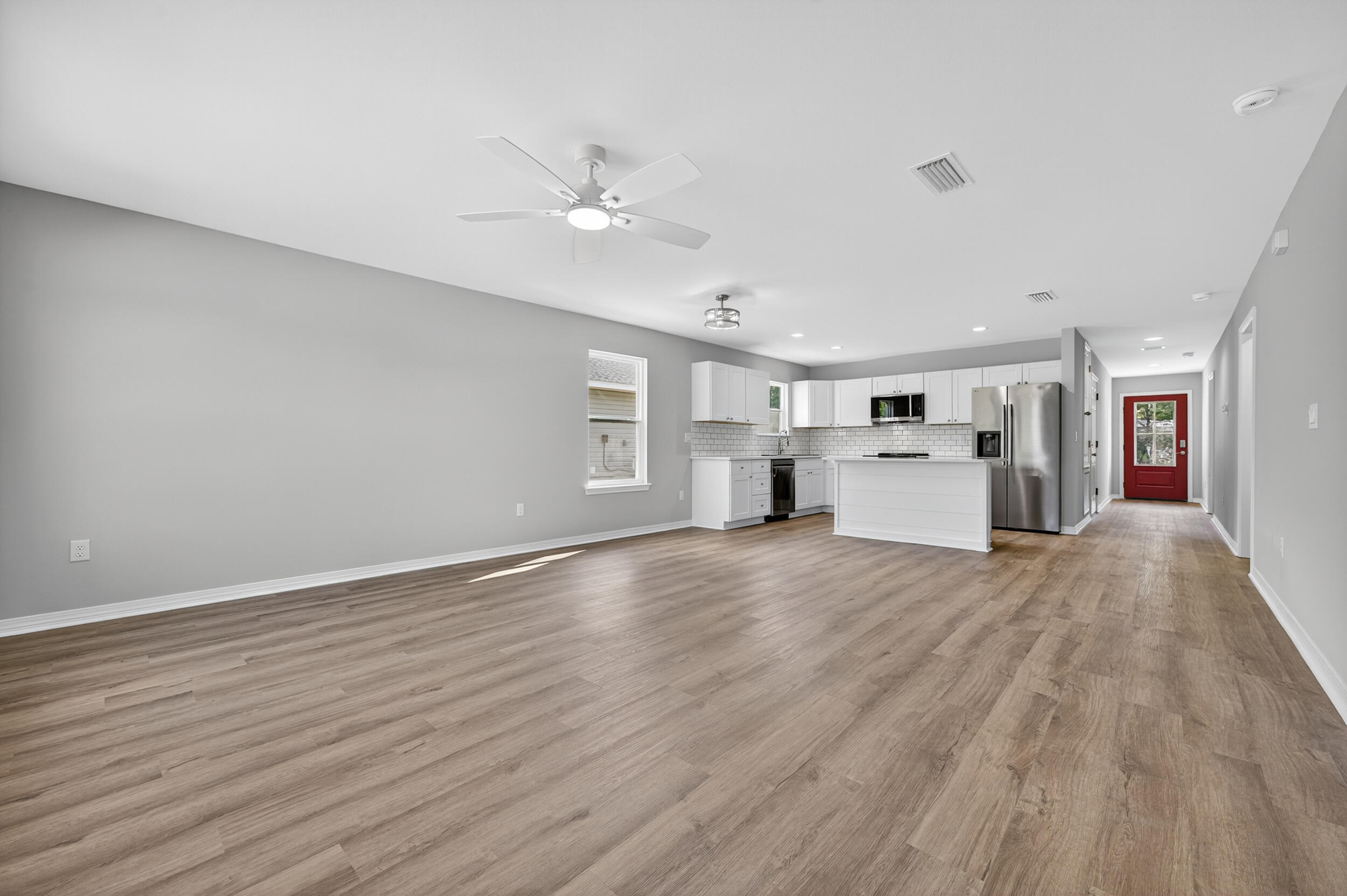 5327 B Kervin Road Crestview, FL 32539 - Photo 20 of 47 a view of empty room with wooden floor