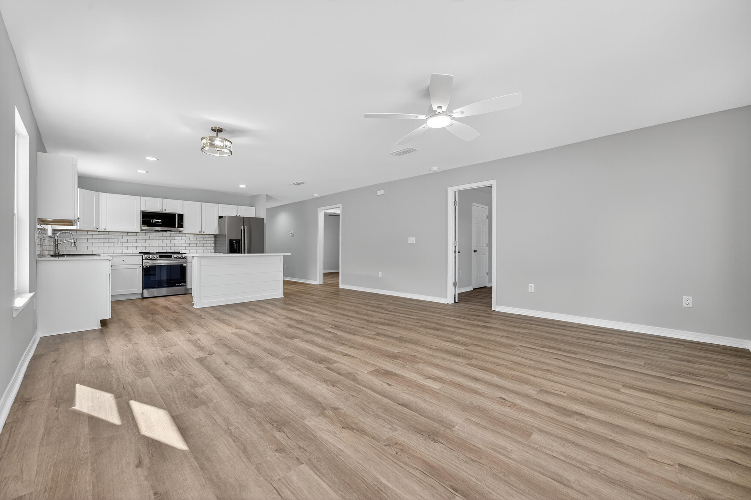 5327 B Kervin Road Crestview, FL 32539 - Photo 21 of 47 a view of a kitchen with a microwave and a stove
