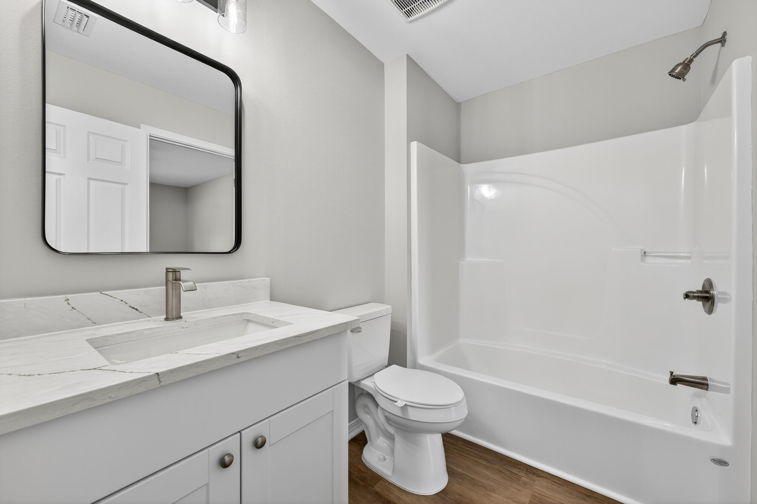 5327 B Kervin Road Crestview, FL 32539 - Photo 28 of 47 a bathroom with a bathtub shower sink vanity mirror and toilet