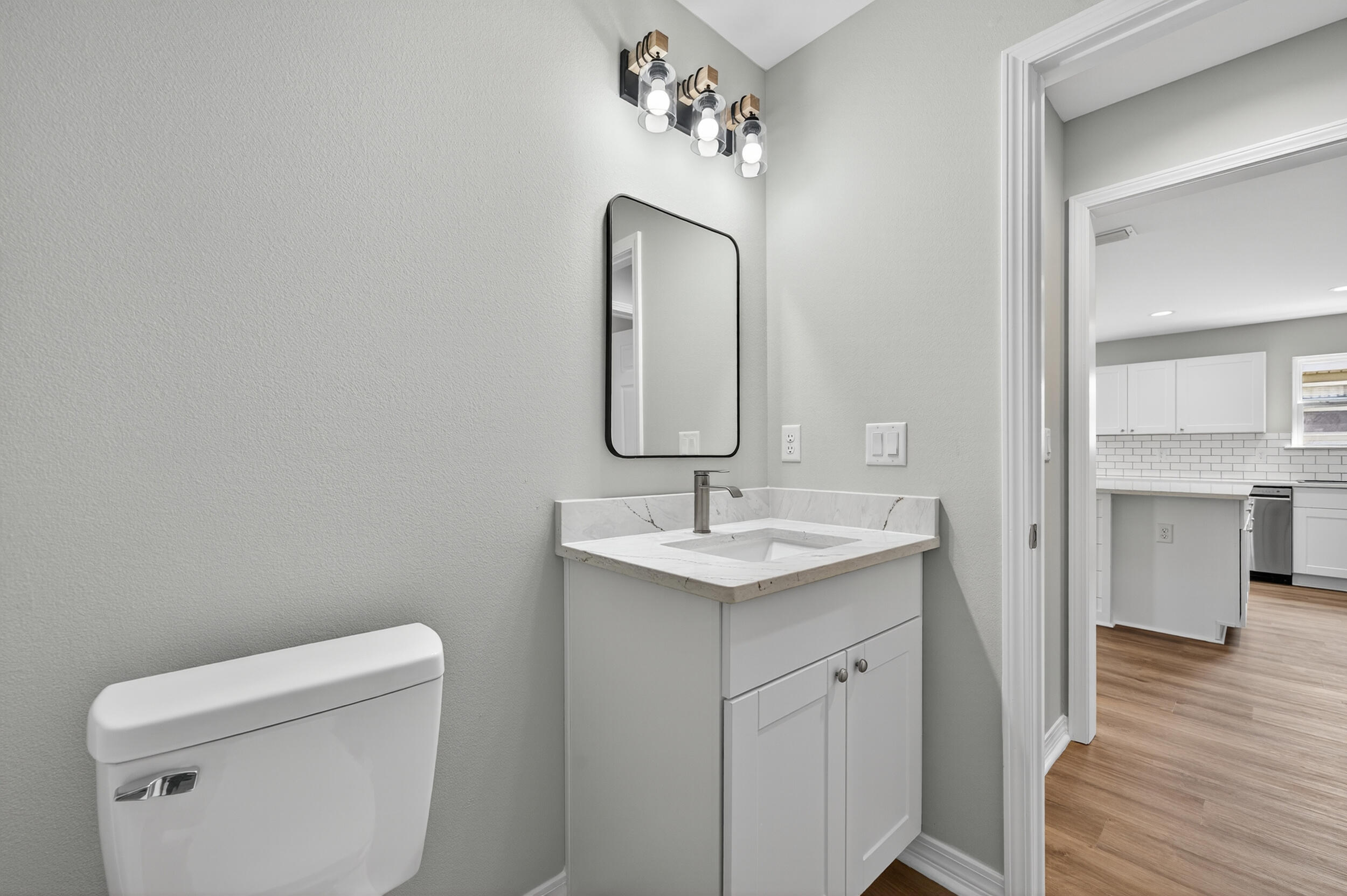 5327 B Kervin Road Crestview, FL 32539 - Photo 33 of 47 a bathroom with a toilet sink and mirror