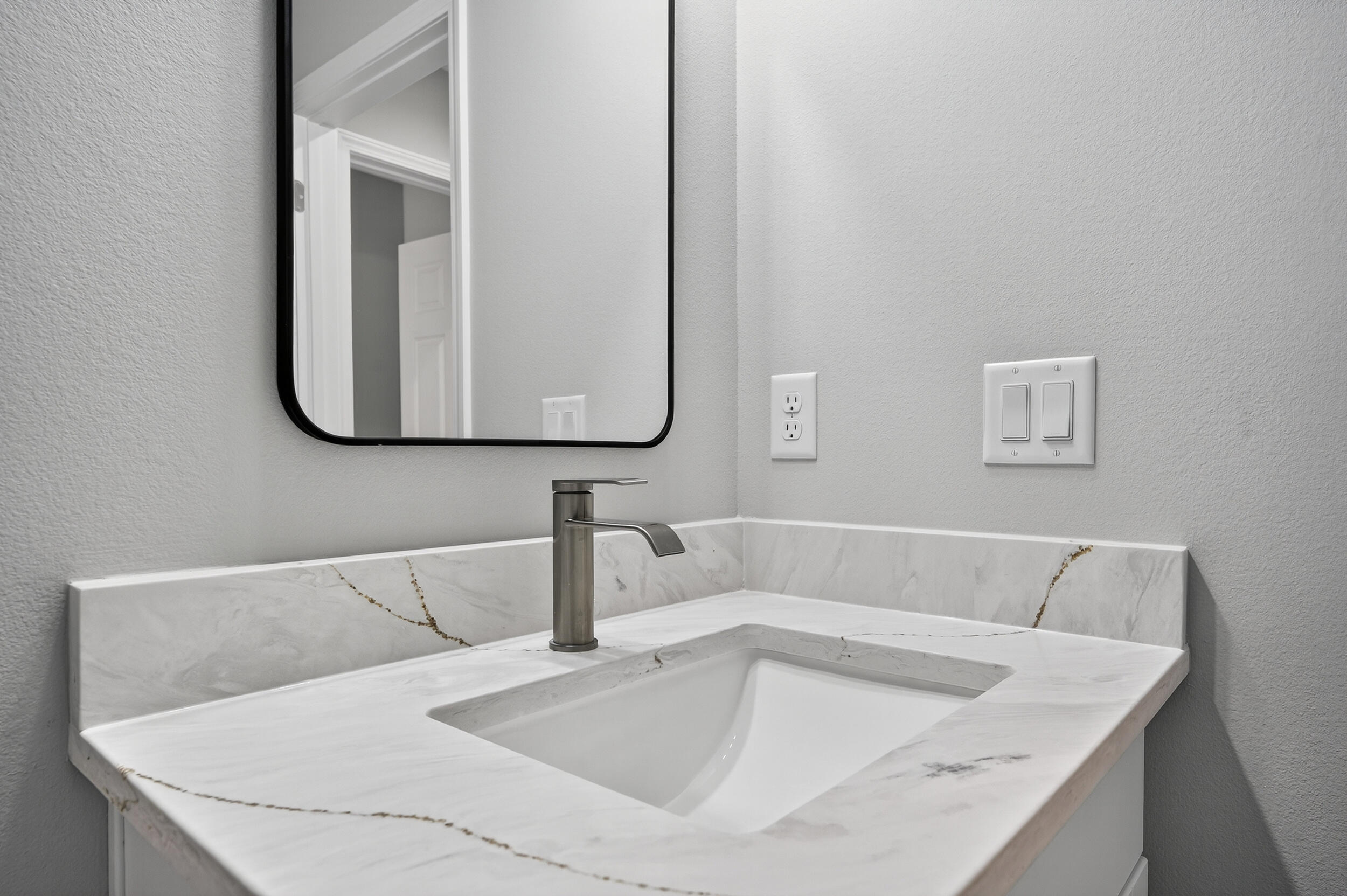 5327 B Kervin Road Crestview, FL 32539 - Photo 34 of 47 a bathroom with a granite countertop sink and a mirror