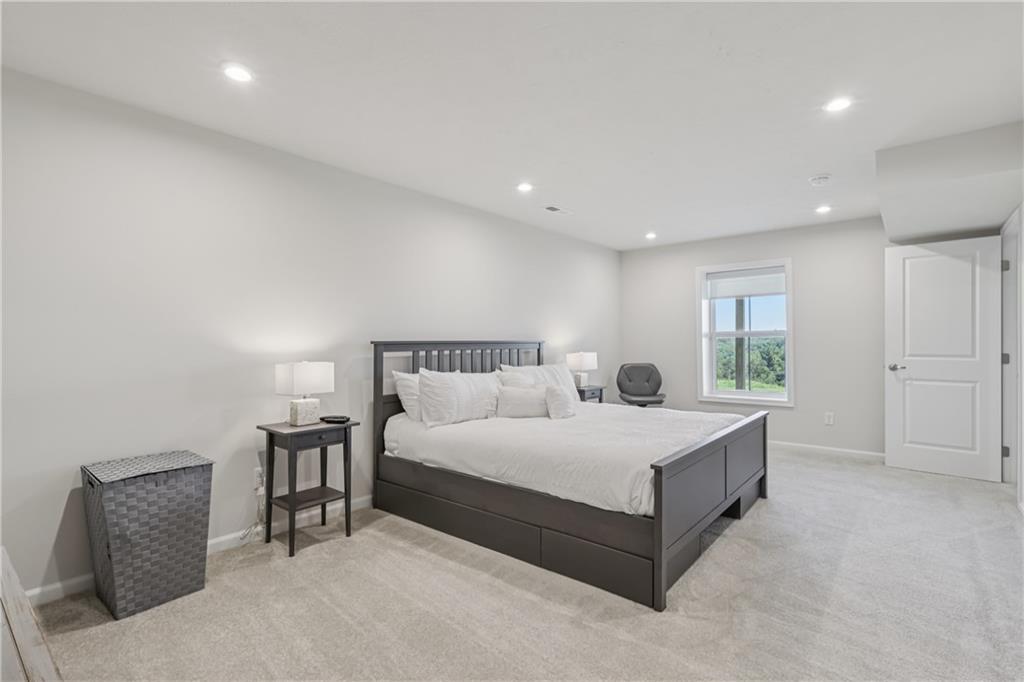 332 Red Bud Lane Washington, PA 15301 - Photo 23 of 47 a spacious bedroom with a bed and a couch