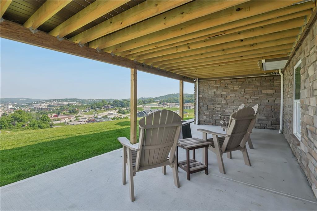 332 Red Bud Lane Washington, PA 15301 - Photo 33 of 47 a patio with table and chairs and potted plants