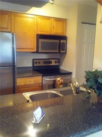 a room with furniture and a flat screen tv