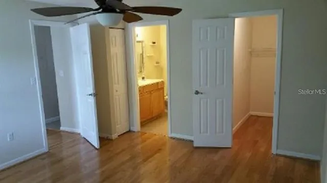 a view of hallway with wooden floor
