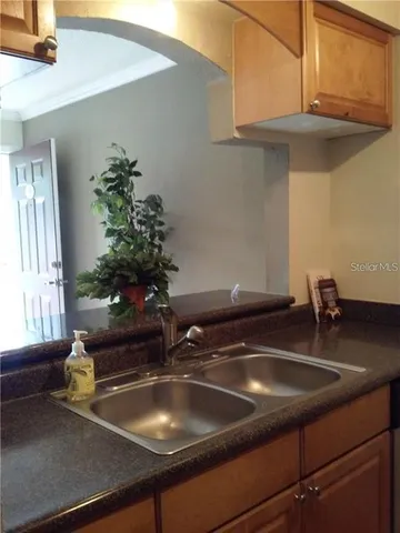 a kitchen with a sink and cabinets