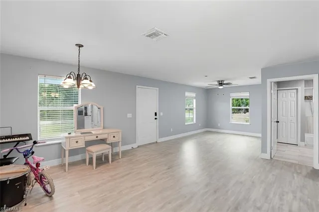 a living room with furniture and window