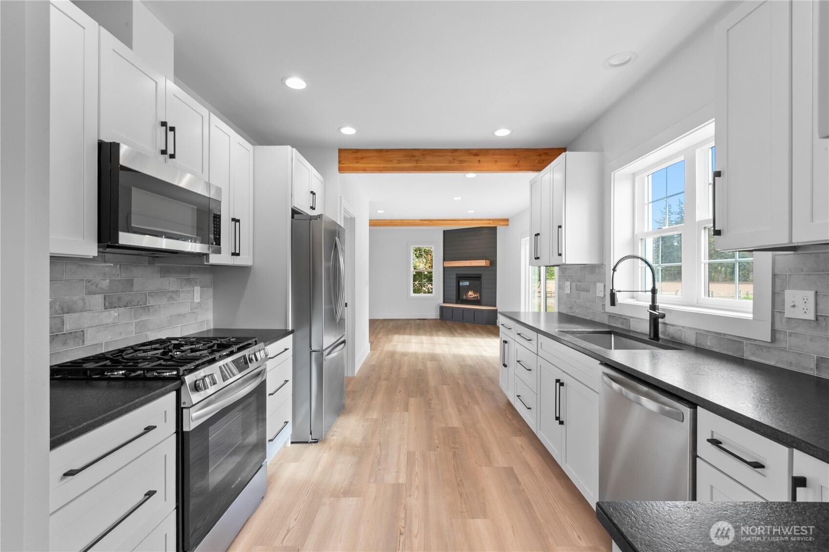 893 Loomis Trail Road Lynden, WA 98264 - Photo 11 of 39 a large kitchen with stainless steel appliances granite countertop a stove and a sink