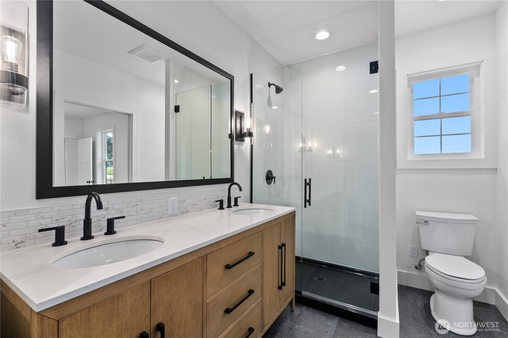 893 Loomis Trail Road Lynden, WA 98264 - Photo 16 of 39 a bathroom with a sink a toilet and large mirror