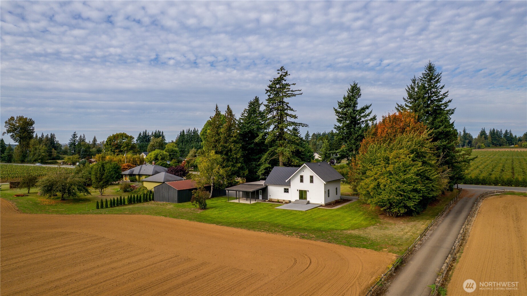 893 Loomis Trail Road Lynden, WA 98264 - Photo 36 of 39 a picture of a garden with plants and large trees