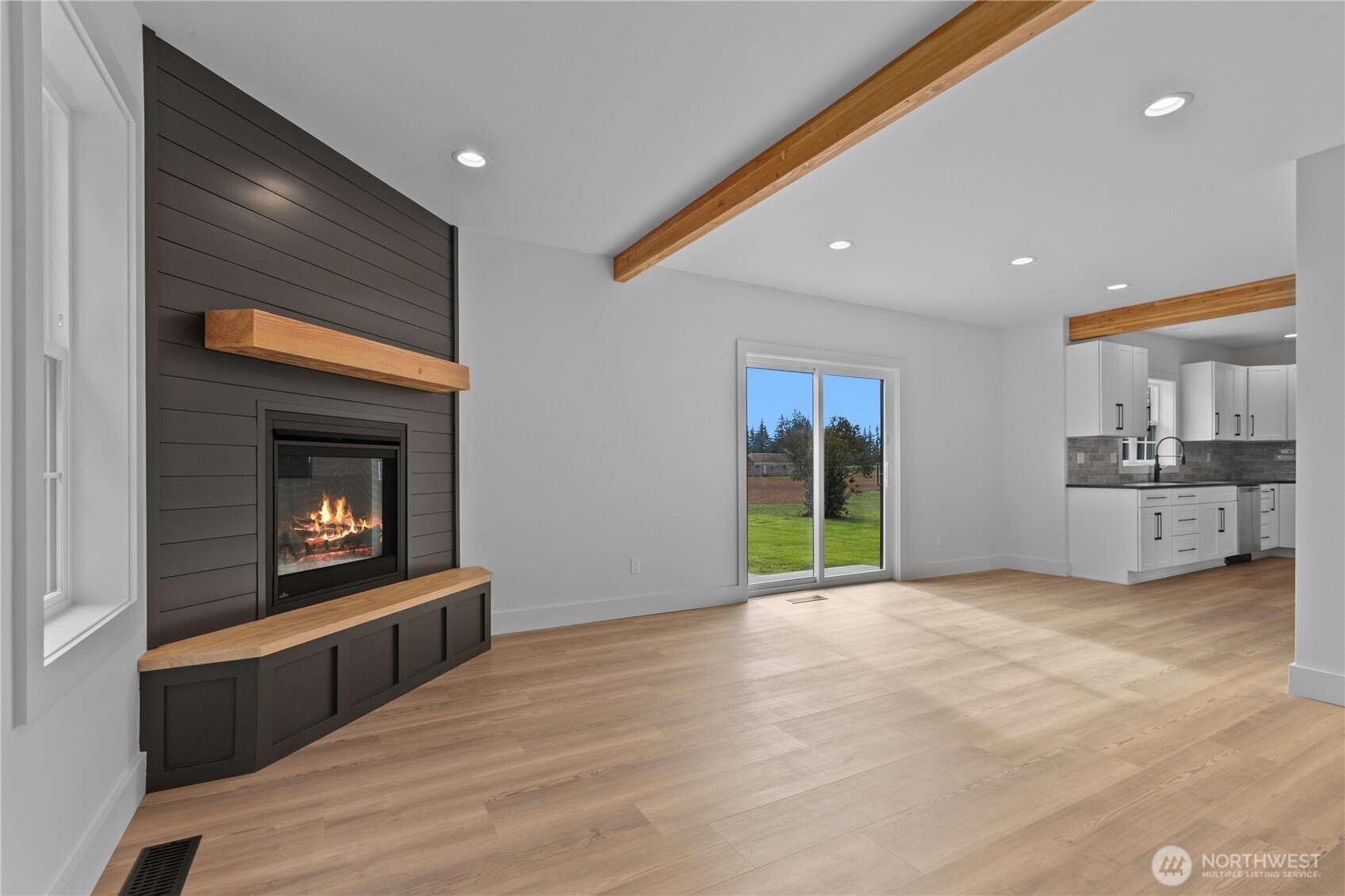 893 Loomis Trail Road Lynden, WA 98264 - Photo 8 of 39 a view of an empty room with a fireplace and a window