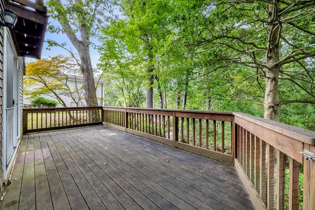 a view of balcony with wooden floor