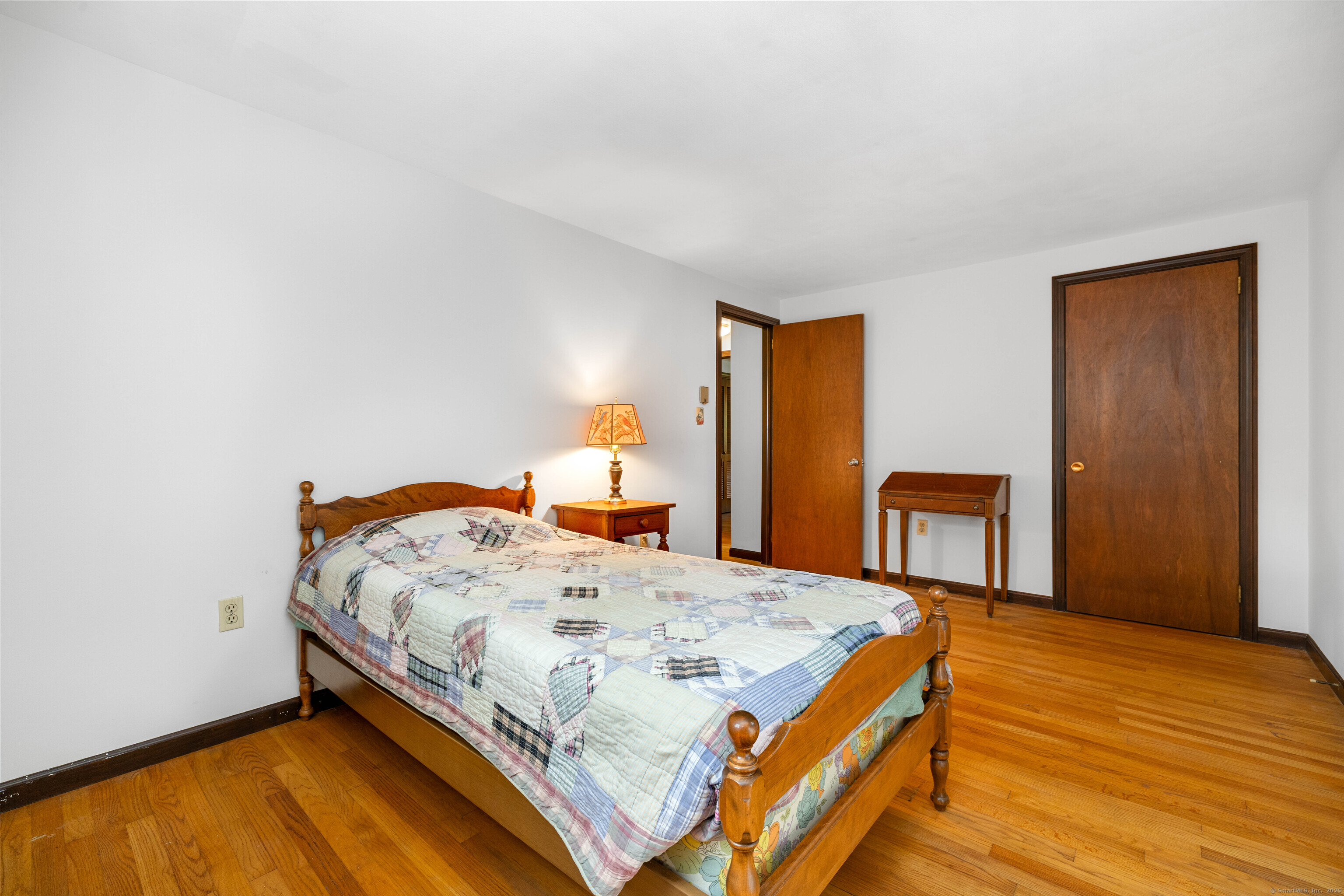 6 Fulmore Drive Waterford, CT 06385 - Photo 29 of 38 a bedroom with a bed and wooden floor