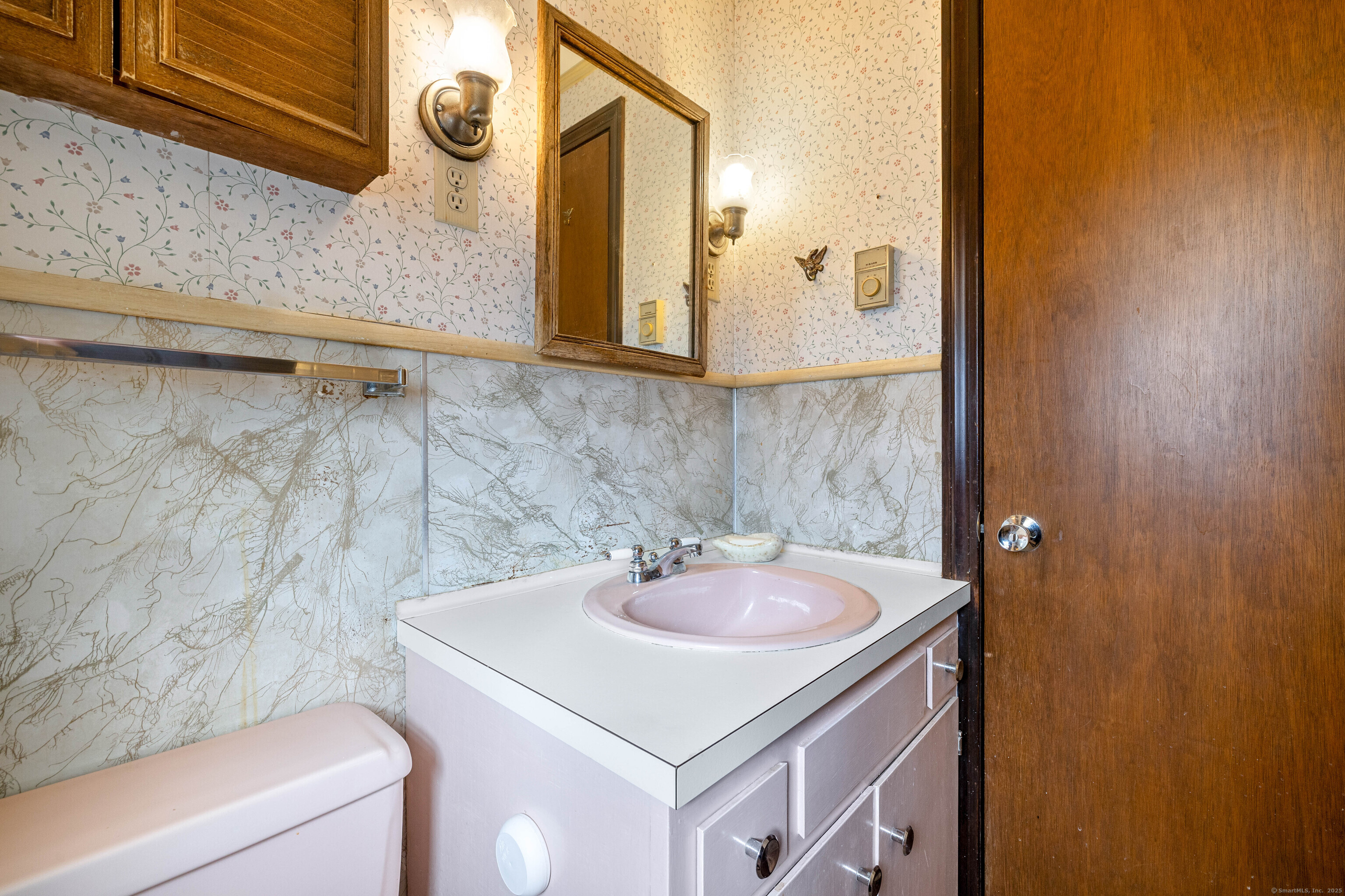 6 Fulmore Drive Waterford, CT 06385 - Photo 32 of 38 a bathroom with a sink and a mirror
