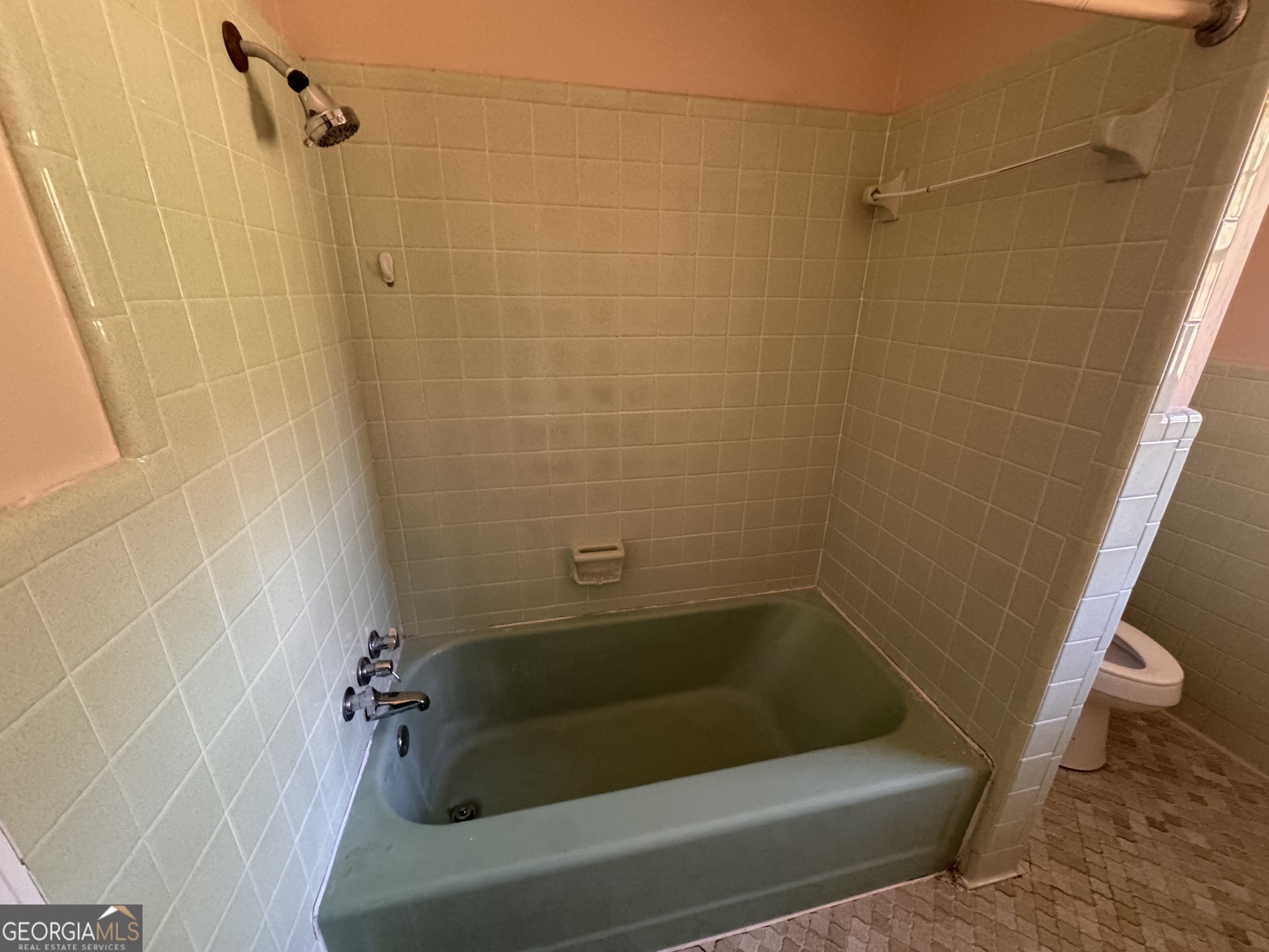 5175 Forest Drive Southeast Covington, GA 30014 - Photo 11 of 30 a bathroom with a bathtub