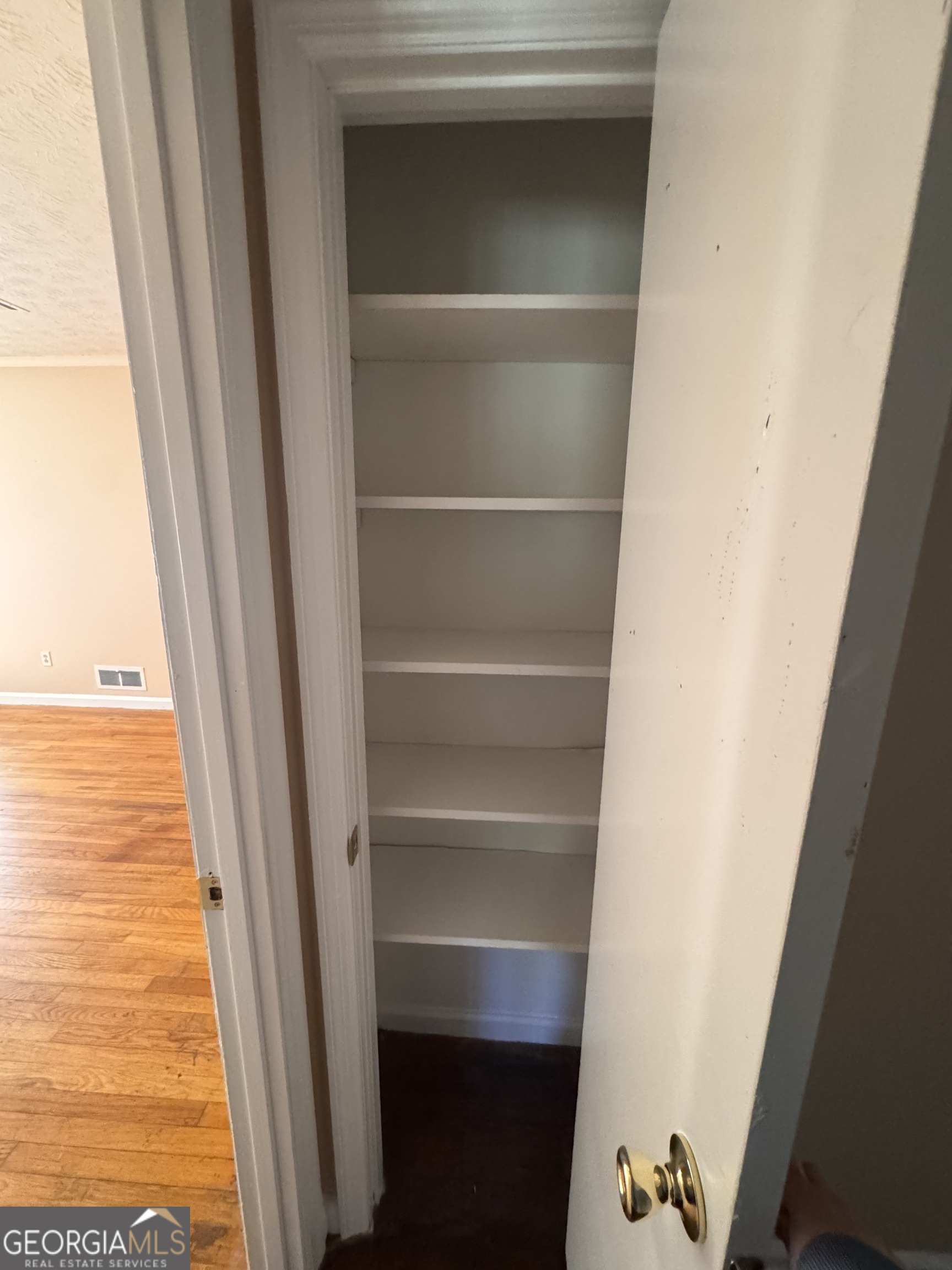 5175 Forest Drive Southeast Covington, GA 30014 - Photo 14 of 30 a view of walk in closet with empty racks