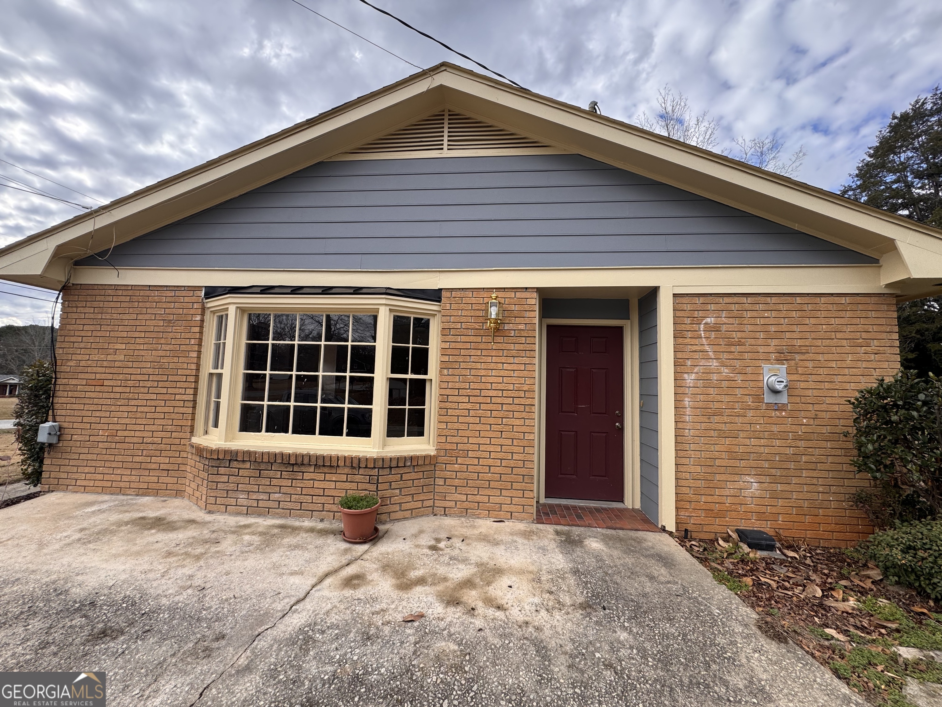 5175 Forest Drive Southeast Covington, GA 30014 - Photo 2 of 30 a front view of a house with a yard
