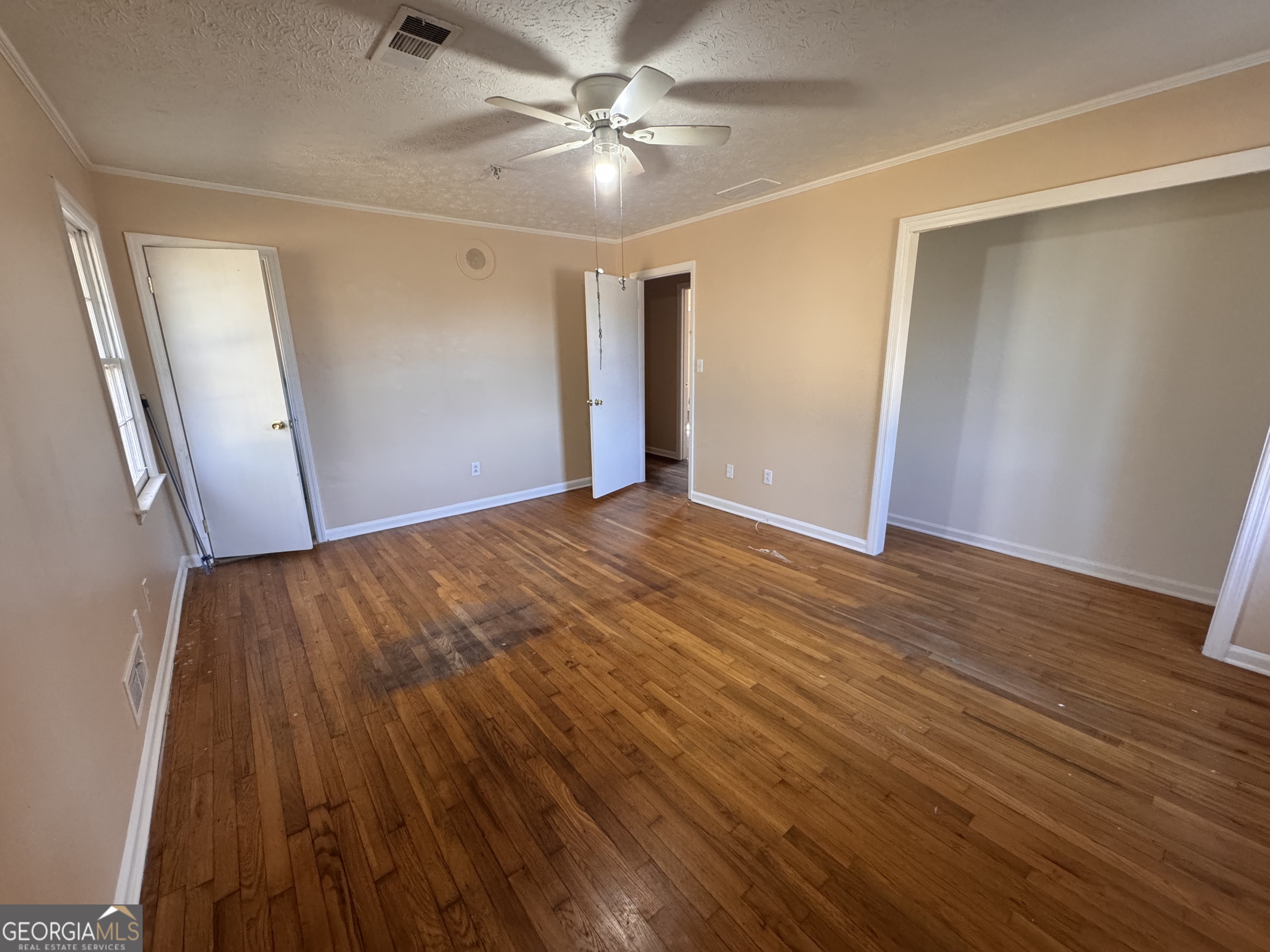 5175 Forest Drive Southeast Covington, GA 30014 - Photo 21 of 30 a view of an empty room with wooden floor