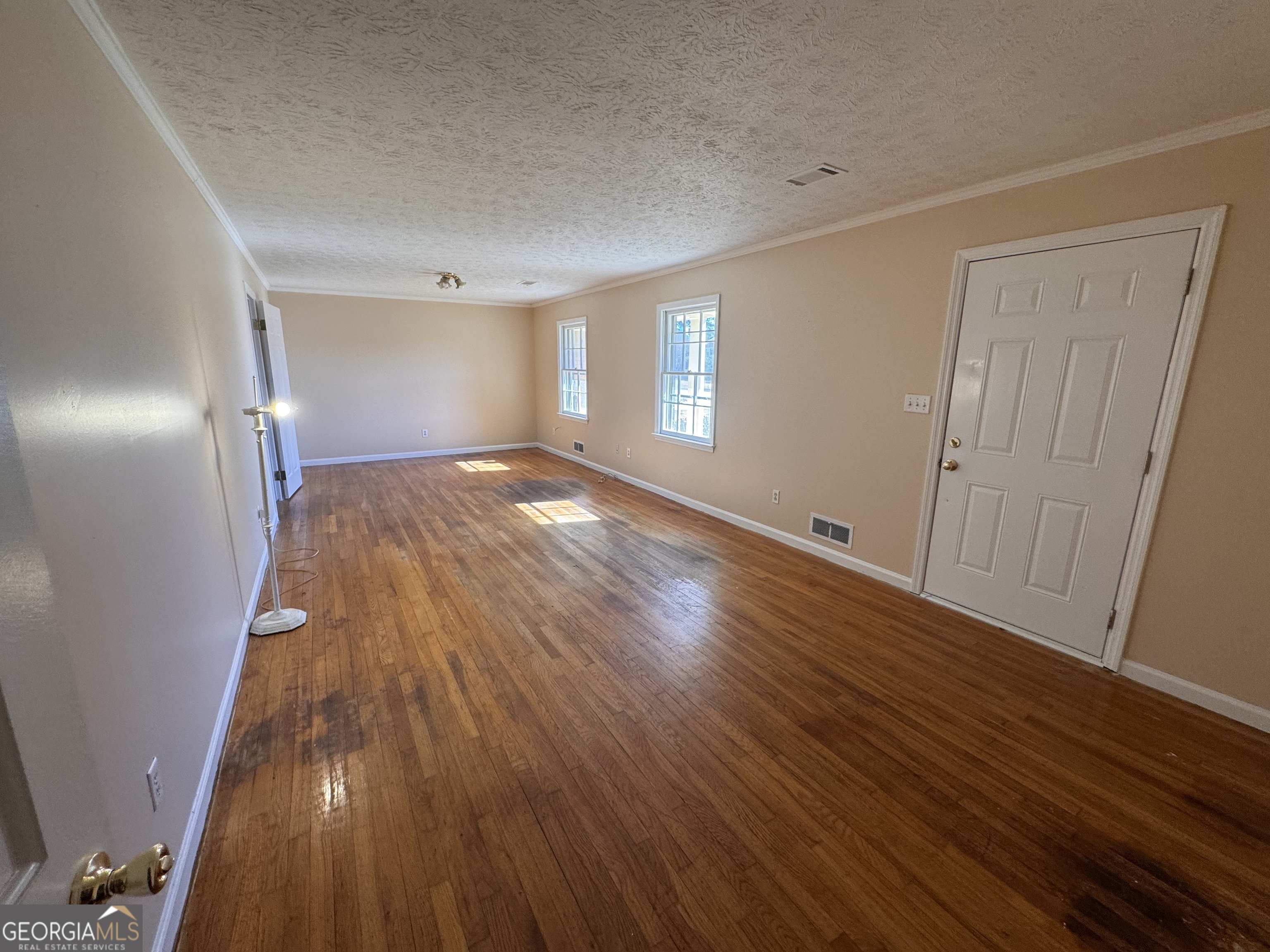 5175 Forest Drive Southeast Covington, GA 30014 - Photo 22 of 30 wooden floor in an empty room with a window
