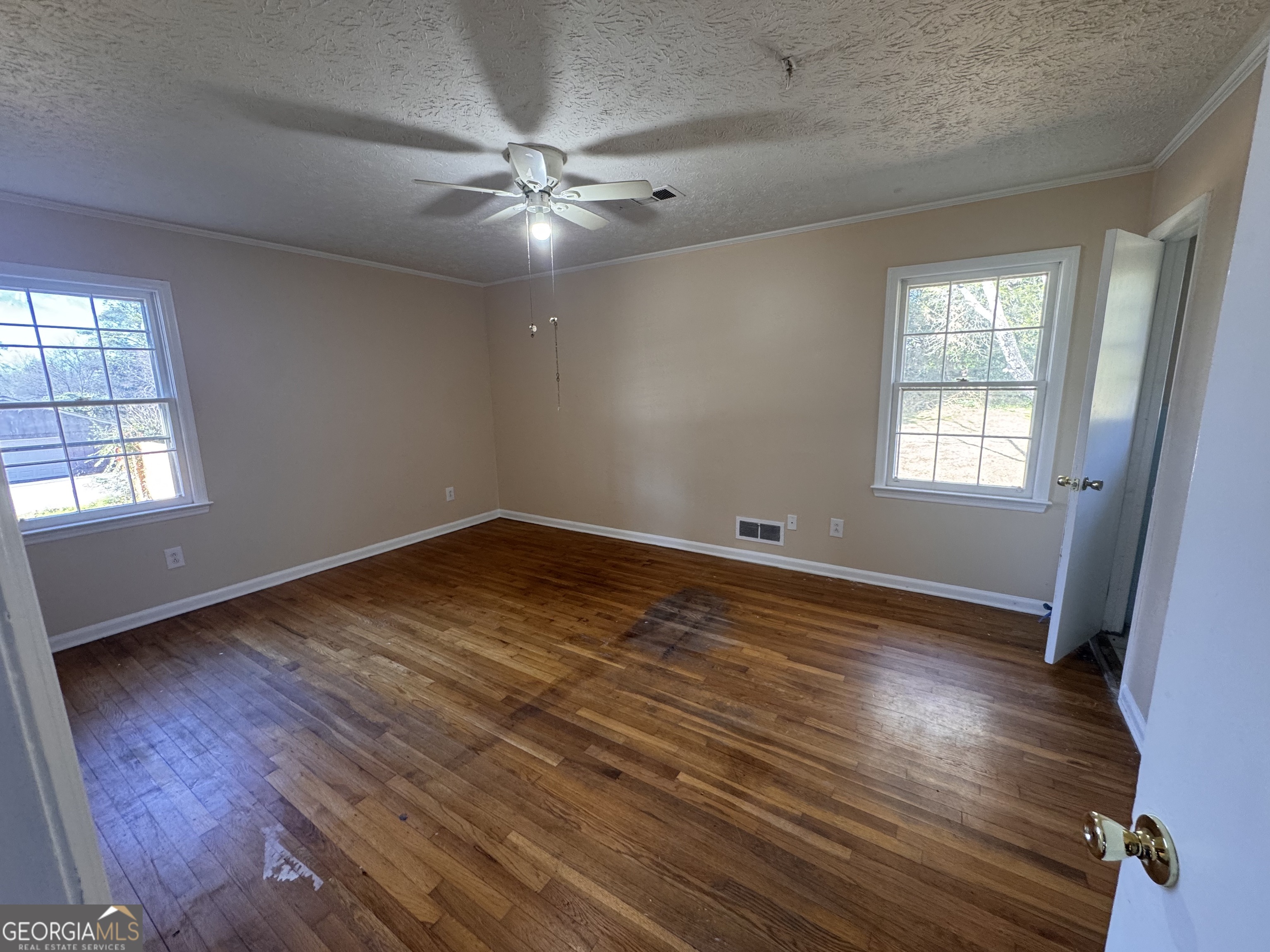 5175 Forest Drive Southeast Covington, GA 30014 - Photo 23 of 30 wooden floor in an empty room with a window
