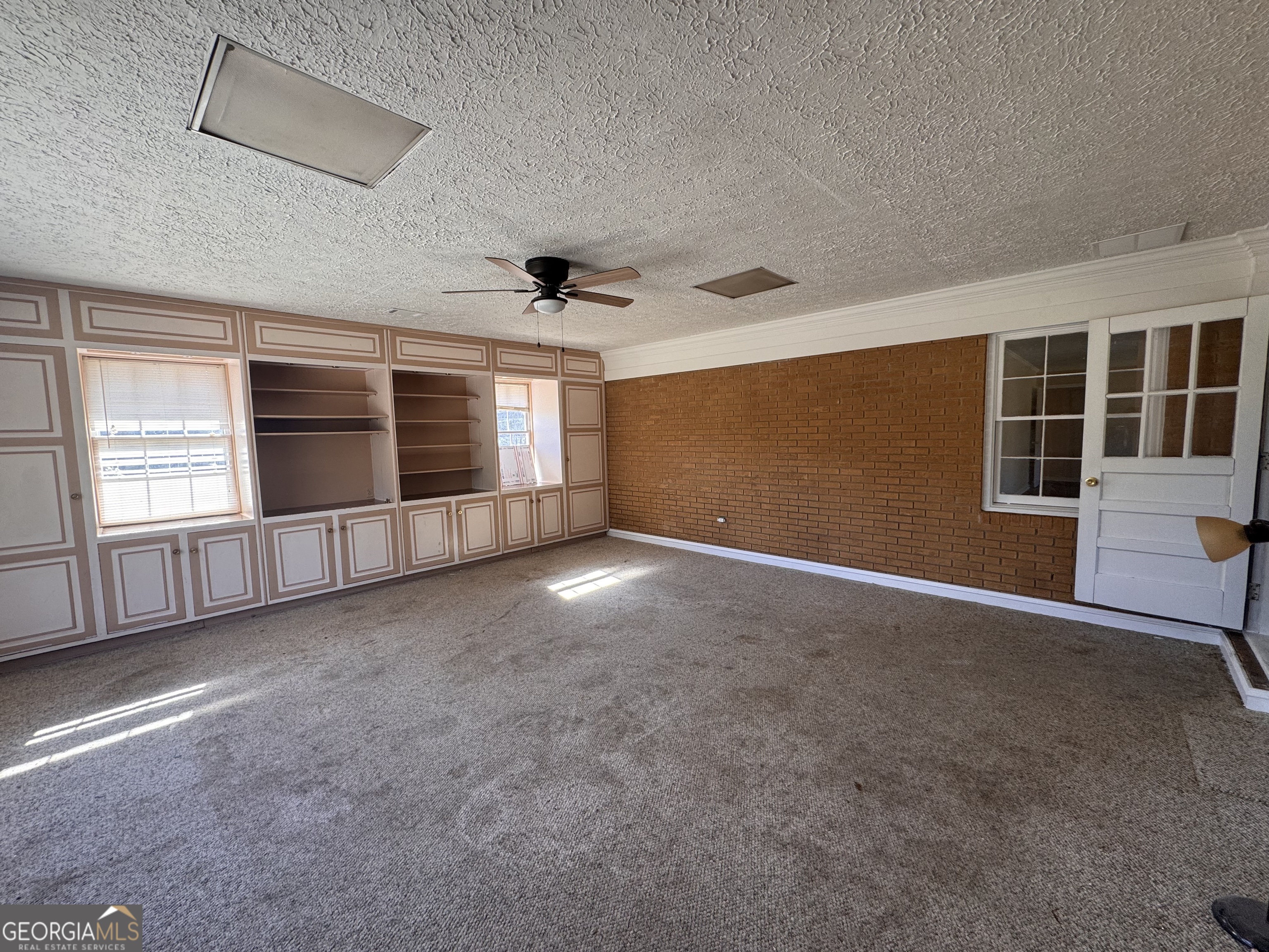 5175 Forest Drive Southeast Covington, GA 30014 - Photo 7 of 30 an empty room with windows