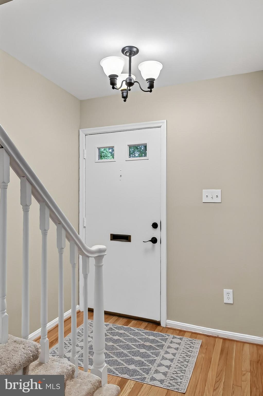 5833 Royal Ridge Drive, Unit 943 Springfield, VA 22152 - Photo 44 of 45 a view of entryway with wooden floor