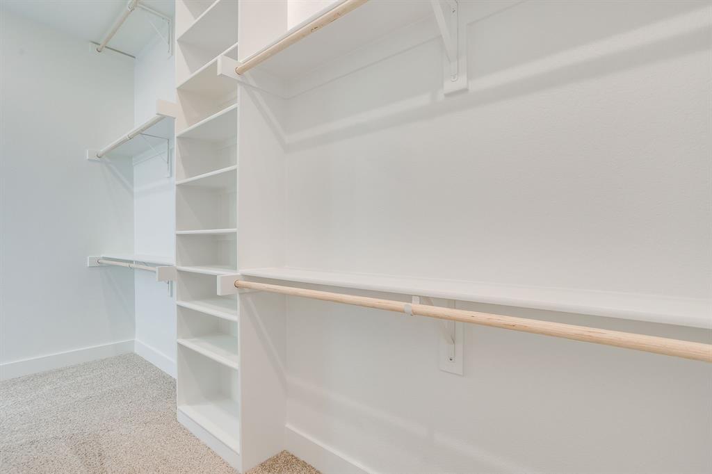 10611 Rye Bread Lane Venus, TX 76084 - Photo 24 of 36 Built-in storage solutions with multiple shelving units and hanging rods