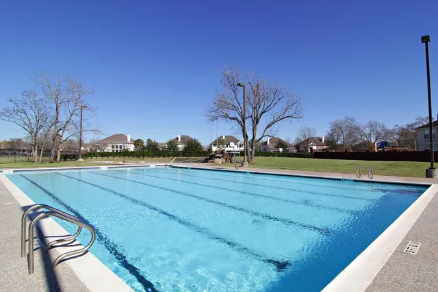 a view of outdoor space with garden and trees