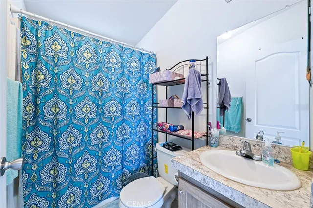 a bedroom with furniture and a bed