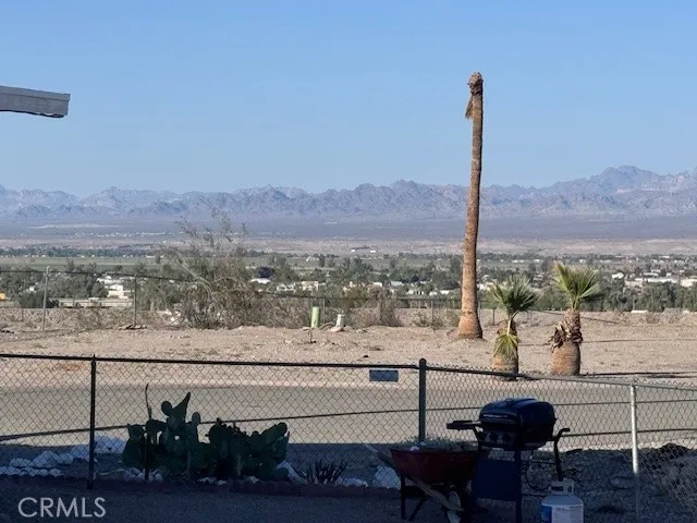 a swimming pool with an outdoor space and seating area