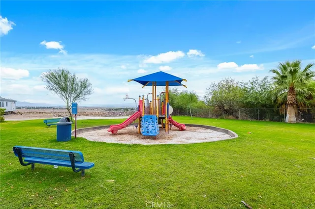 a view of swimming pool with outdoor seating