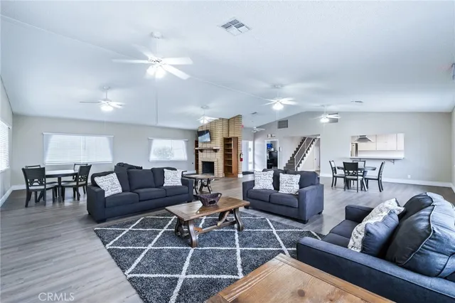 a front view of a building with palm trees