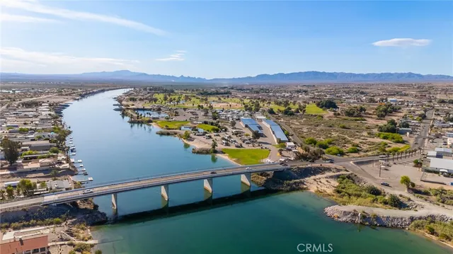 a view of a terrace with lawn chairs