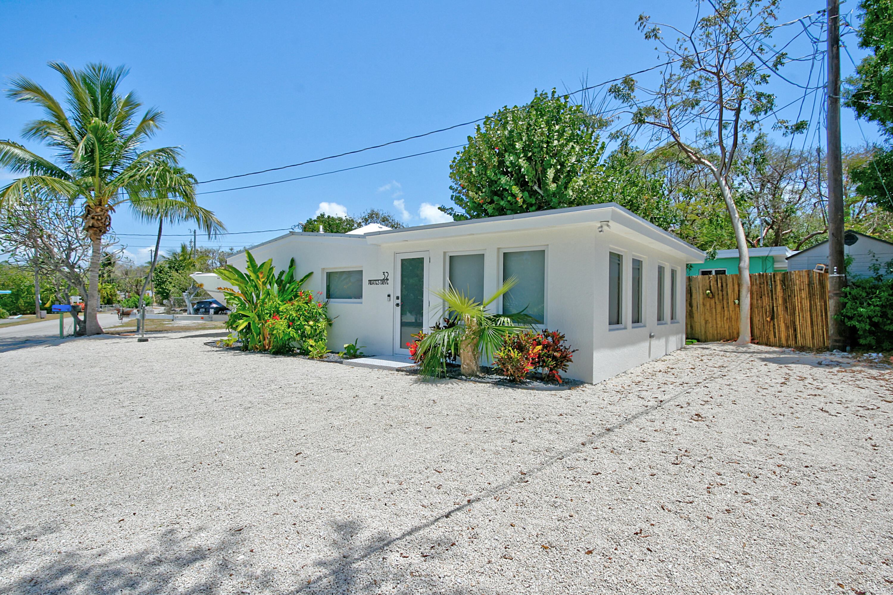 32 Pirates Drive Key Largo, FL 33037 - Photo 3 of 25 a view of a house with a patio