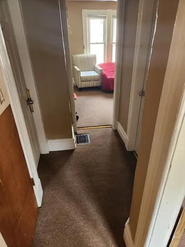 a view of a room with a furniture