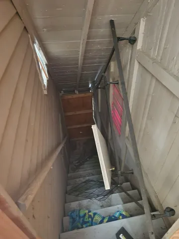 a view of staircase with wooden floor and stairs
