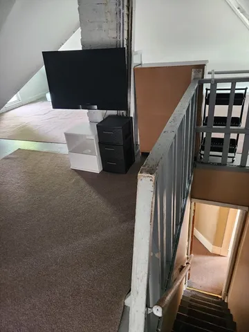 a view of entryway and kitchen