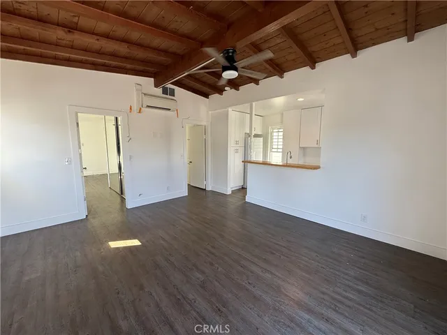 a view of hallway with wooden floor
