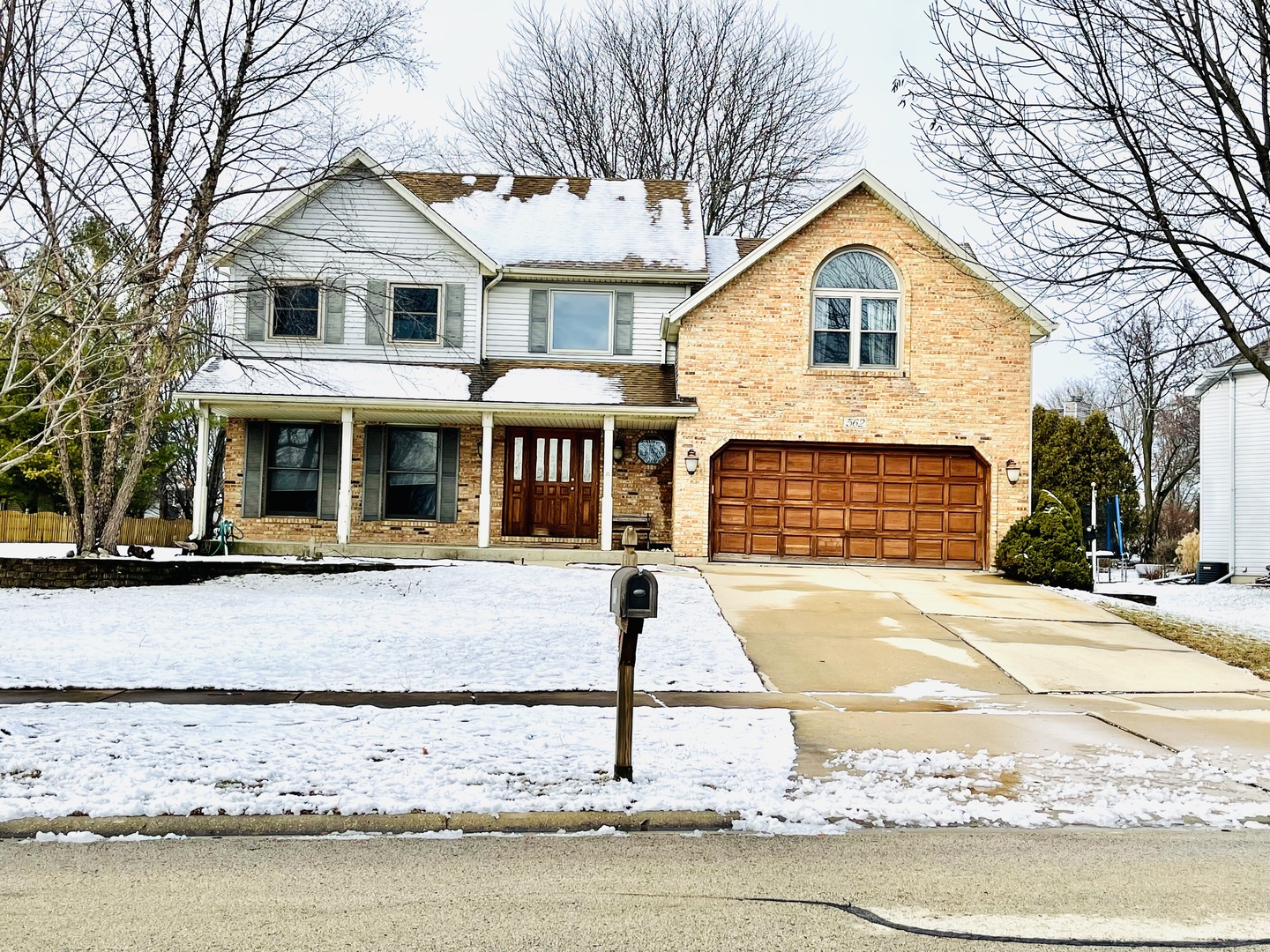 562 Boardman Circle Bolingbrook, IL 60440 - Photo 1 of 14 a front view of a house with a yard and garage